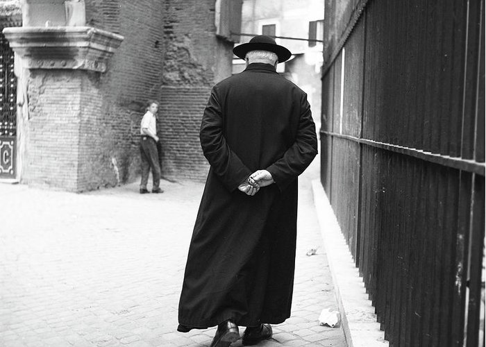 a-priest-walks-down-a-street-in-rome-1955-the-harrington-collection.jpg